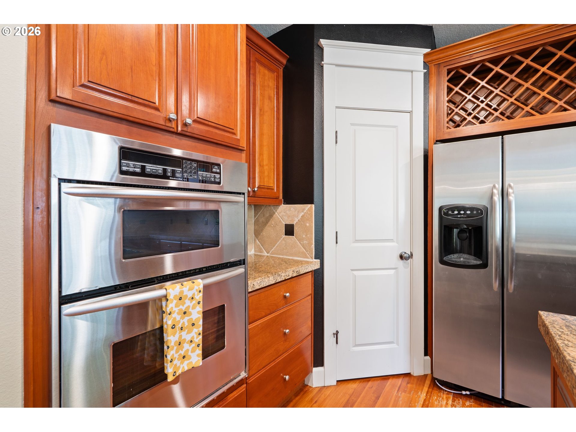 14342 Southeast Donatello Loop Happy Valley, OR 97086 - Photo 13 of 46 a kitchen with stainless steel appliances granite countertop a refrigerator and a stove