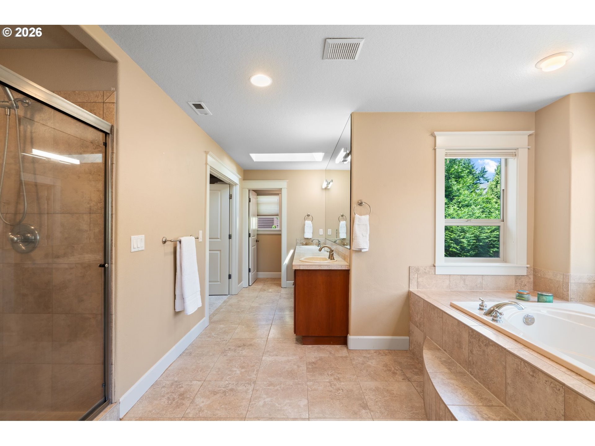 14342 Southeast Donatello Loop Happy Valley, OR 97086 - Photo 26 of 46 a view of bathroom with bathtub and shower
