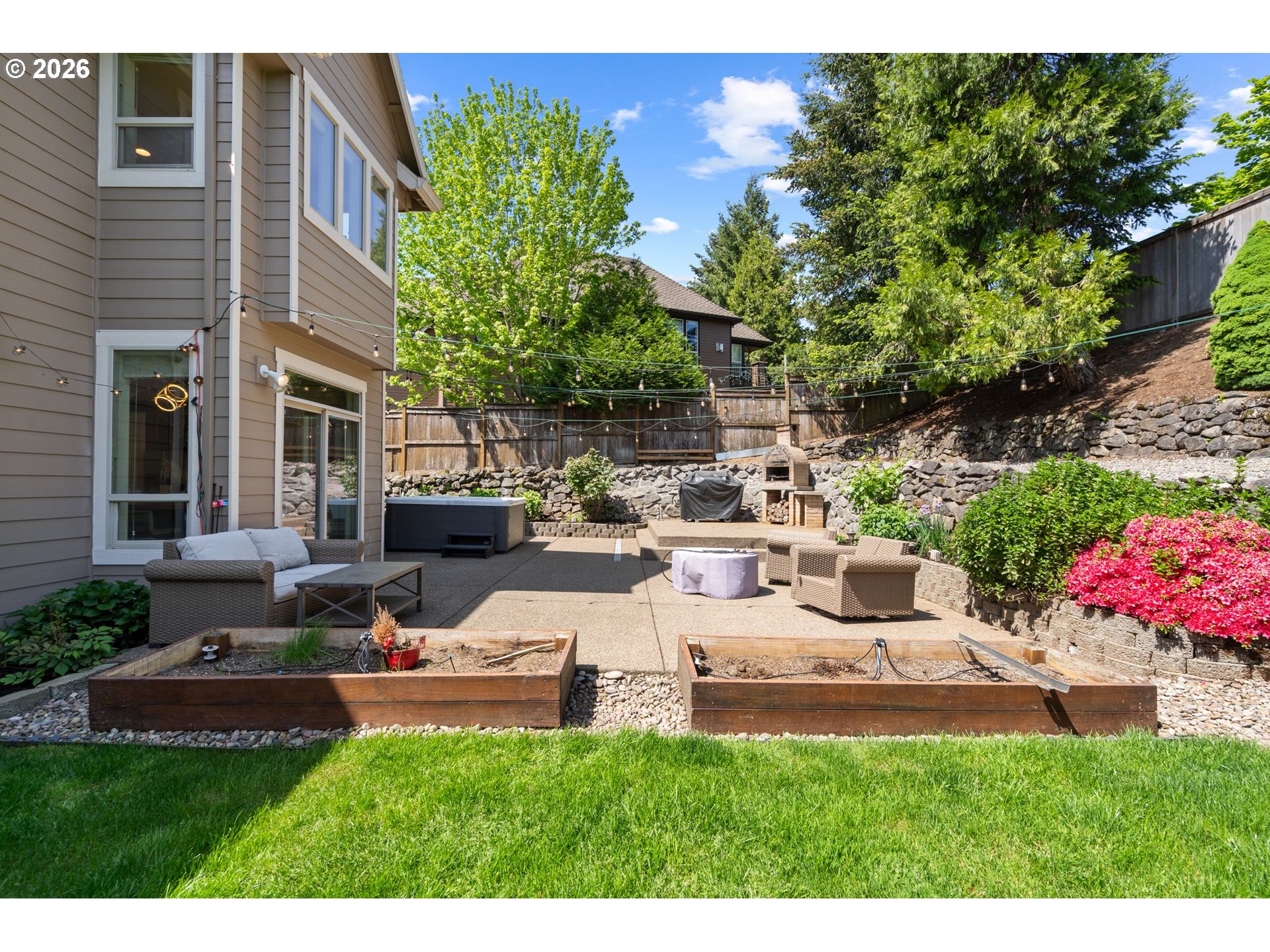 14342 Southeast Donatello Loop Happy Valley, OR 97086 - Photo 41 of 46 a view of backyard of house with outdoor seating and green space