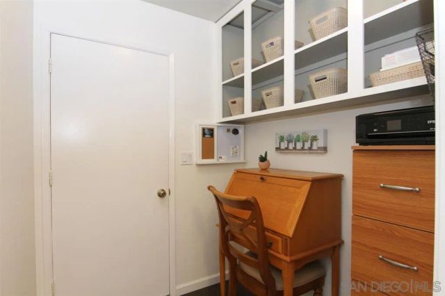 a view of a hallway with seating area