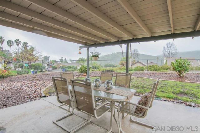 a view of an outdoor dining space with furniture