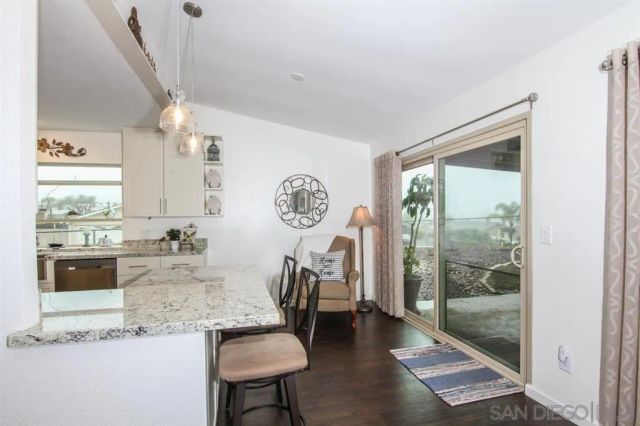 a living room with granite countertop furniture and a large window