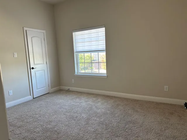 front view of a house with large windows