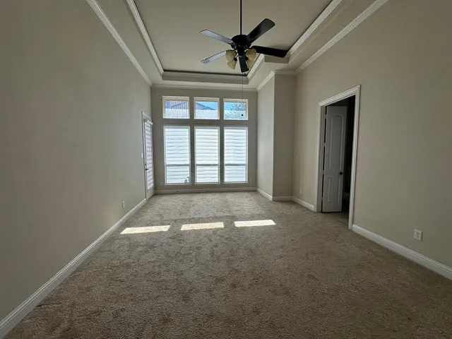 an empty room with a empty space and windows