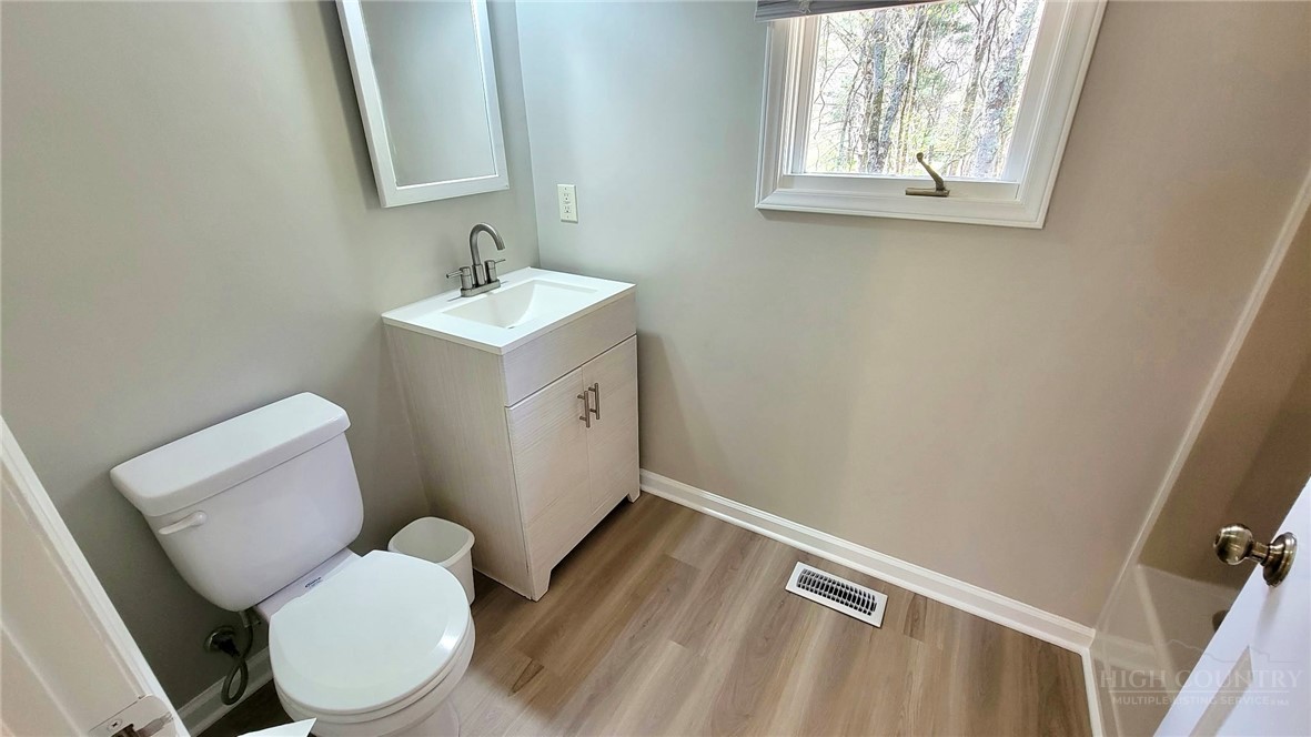 172 Yarrow Lane Boone, NC 28607 - Photo 13 of 30 a bathroom with a toilet sink and mirror