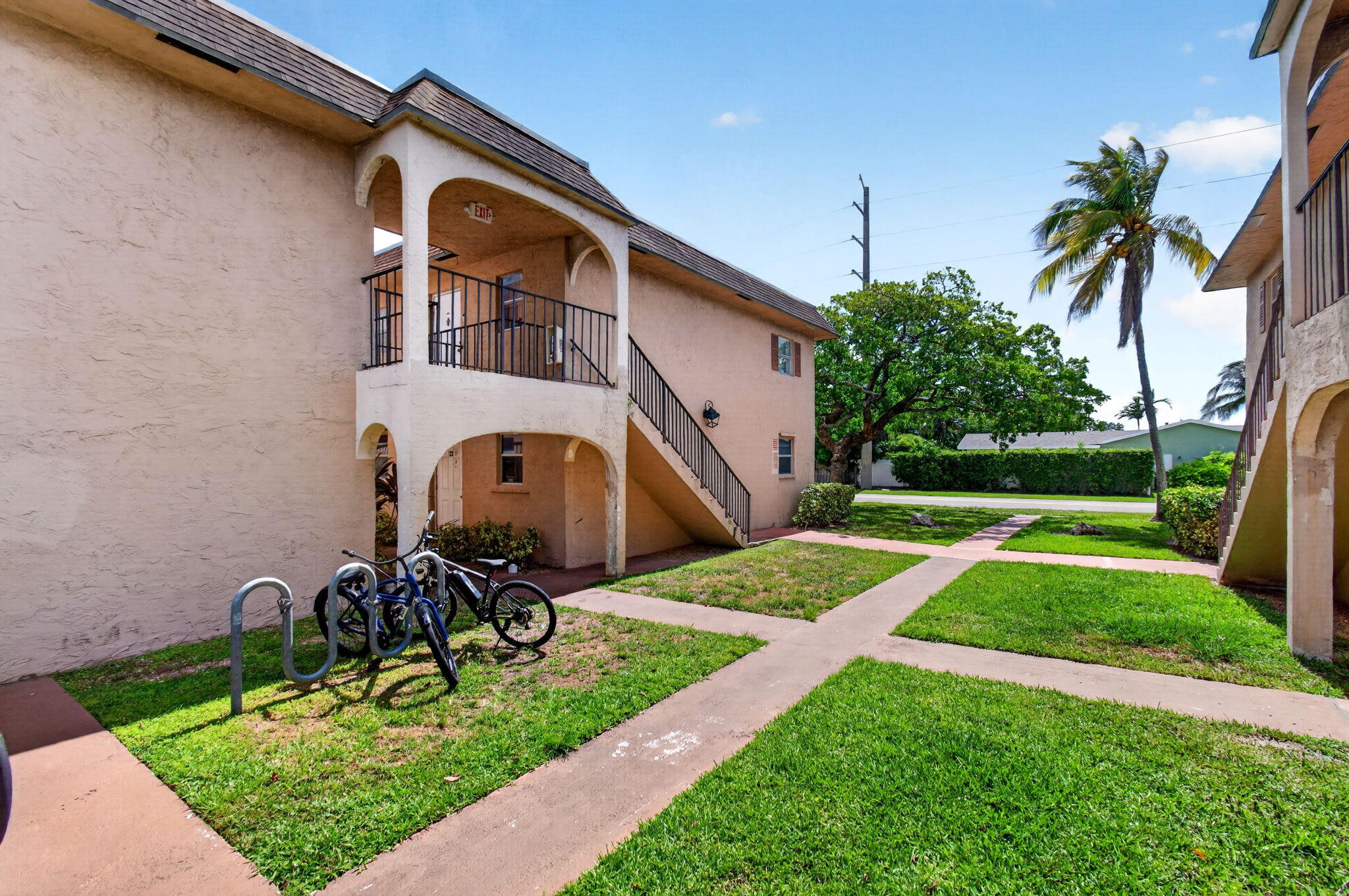 600 Southwest 2nd Avenue, Unit 240 Boca Raton, FL 33432 - Photo 52 of 54 a front view of a house with garden