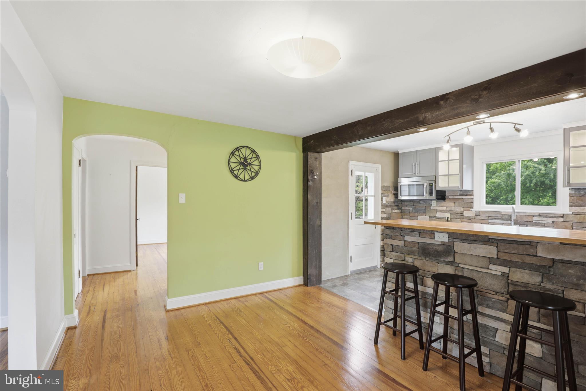 169 School House Road Lancaster, PA 17603 - Photo 10 of 39 a kitchen with stainless steel appliances a dining table chairs and wooden floor