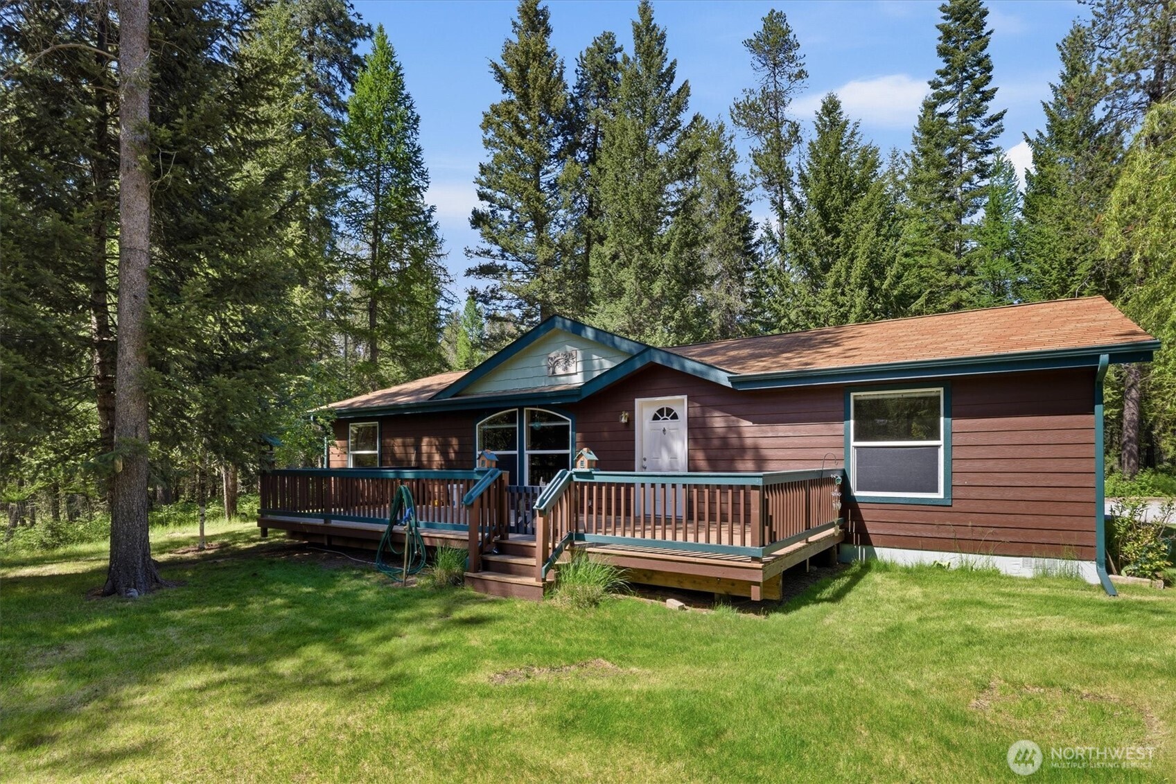 1142 Driskill Road Newport, WA 99156 - Photo 34 of 40 a view of a house with a yard and deck