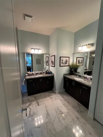 a large bathroom with a large tub and sink