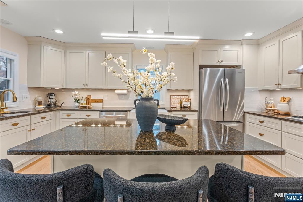 163 La Rue Road West Milford, NJ 07435 - Photo 11 of 28 a kitchen with stainless steel appliances granite countertop a refrigerator a stove a sink and white cabinets