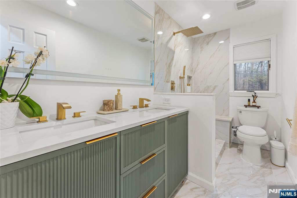 163 La Rue Road West Milford, NJ 07435 - Photo 16 of 28 a bathroom with a granite countertop sink a toilet and a shower
