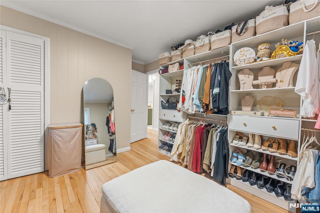163 La Rue Road West Milford, NJ 07435 - Photo 22 of 28 a view of walk in closet with clothes and shoes