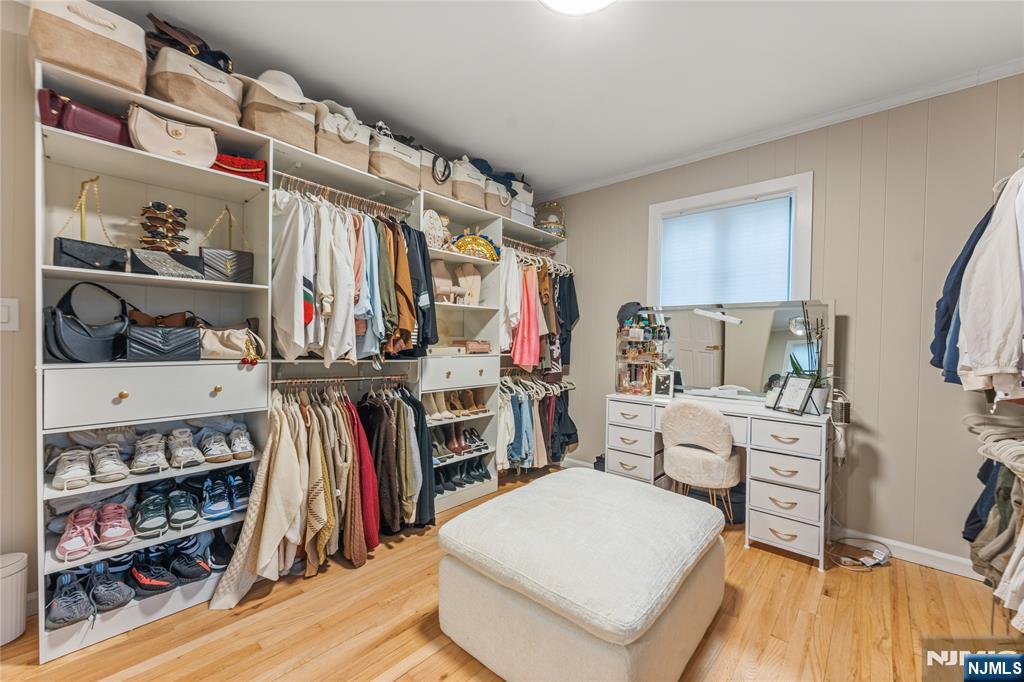163 La Rue Road West Milford, NJ 07435 - Photo 25 of 28 a view of walk in closet with clothes and shoes