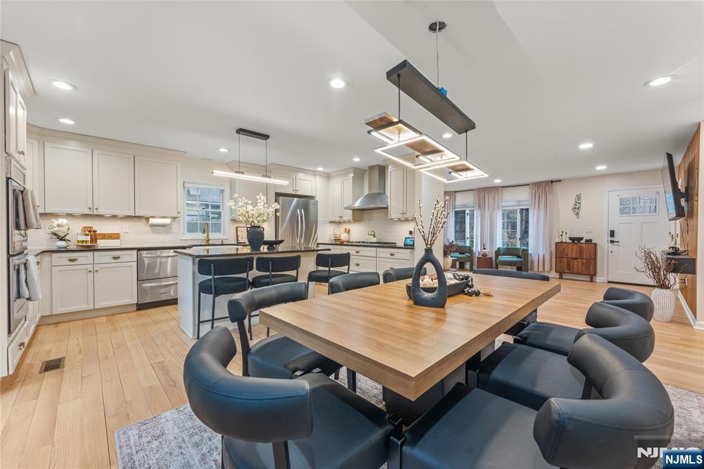 163 La Rue Road West Milford, NJ 07435 - Photo 10 of 28 a living room with furniture kitchen view and a chandelier