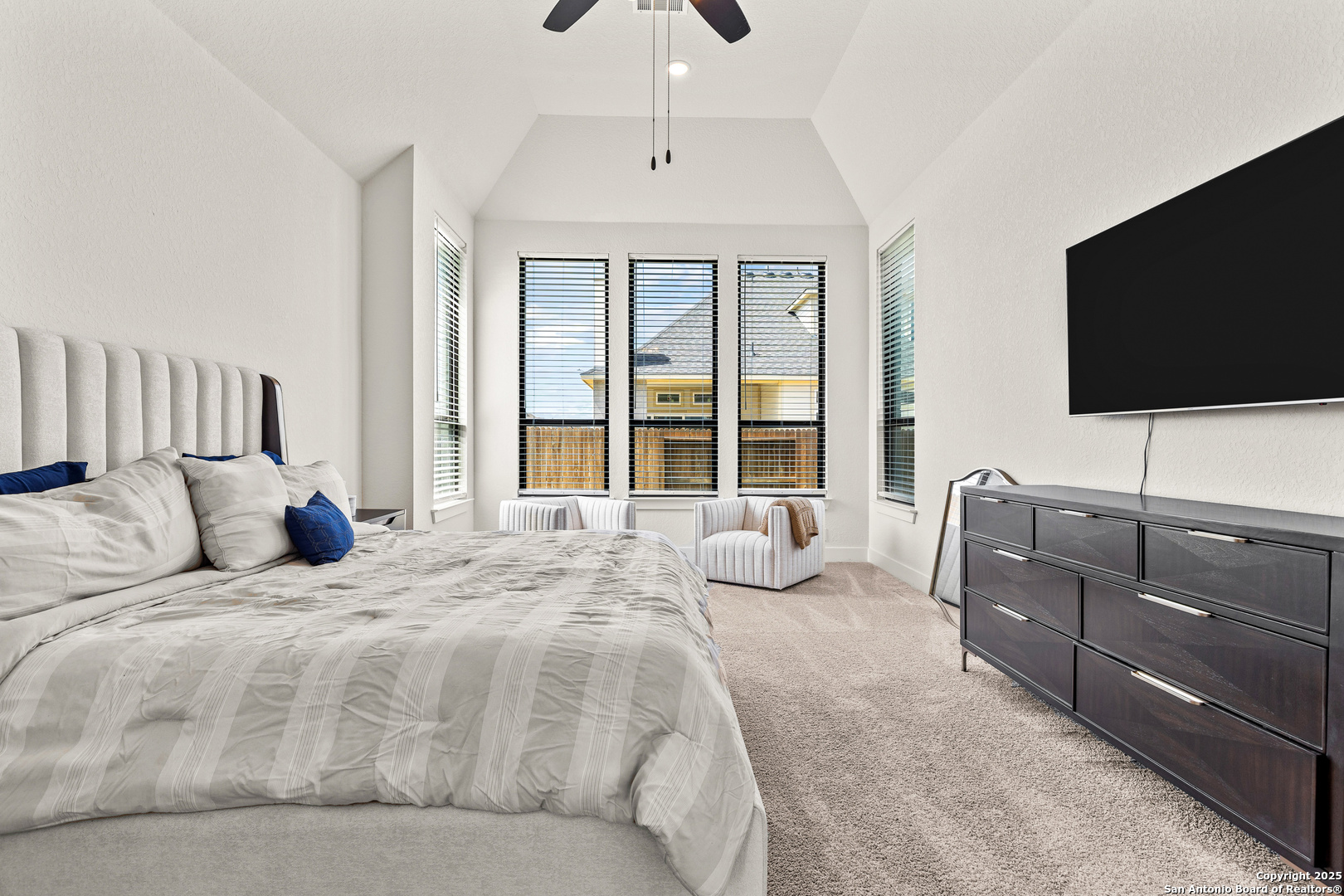 507 Caliban Cibolo, TX 78108 - Photo 27 of 63 a bedroom with a large bed and a flat screen tv