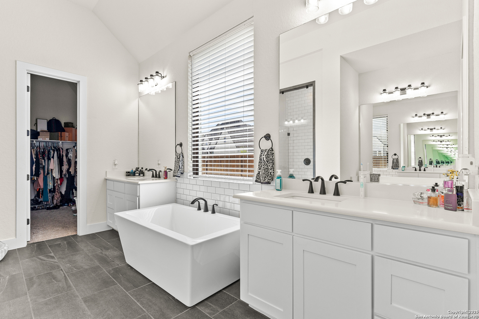 507 Caliban Cibolo, TX 78108 - Photo 29 of 63 a bathroom with double sink and a mirror