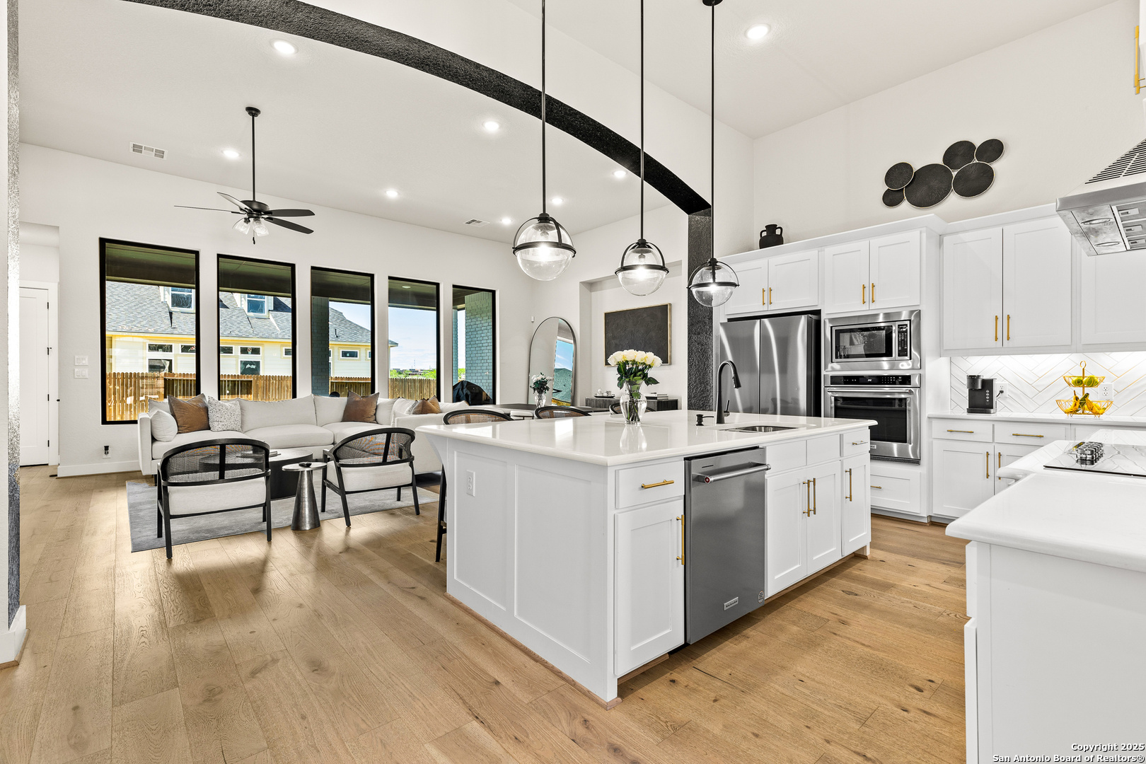 507 Caliban Cibolo, TX 78108 - Photo 6 of 63 a large white kitchen with lots of counter space a sink and appliances