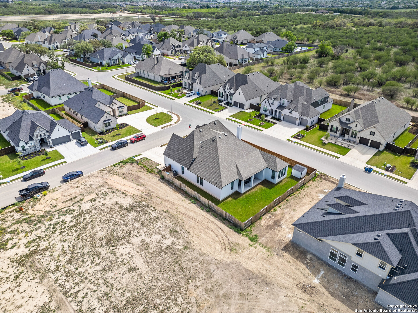 507 Caliban Cibolo, TX 78108 - Photo 61 of 63 an aerial view of a pool with a yard and lake view