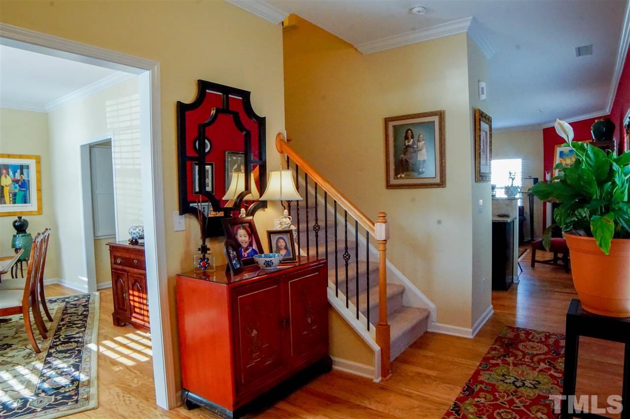 1023 Ileagnes Road Raleigh, NC 27603 - Photo 2 of 25 a view of an entryway with wooden floor and windows