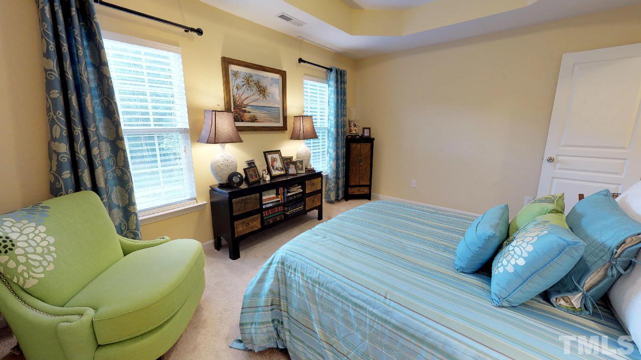 1023 Ileagnes Road Raleigh, NC 27603 - Photo 15 of 25 a bedroom with bed and a couch