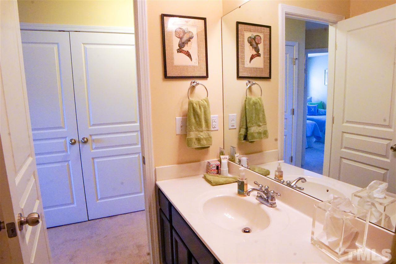 1023 Ileagnes Road Raleigh, NC 27603 - Photo 20 of 25 a bathroom with a sink vanity and a mirror