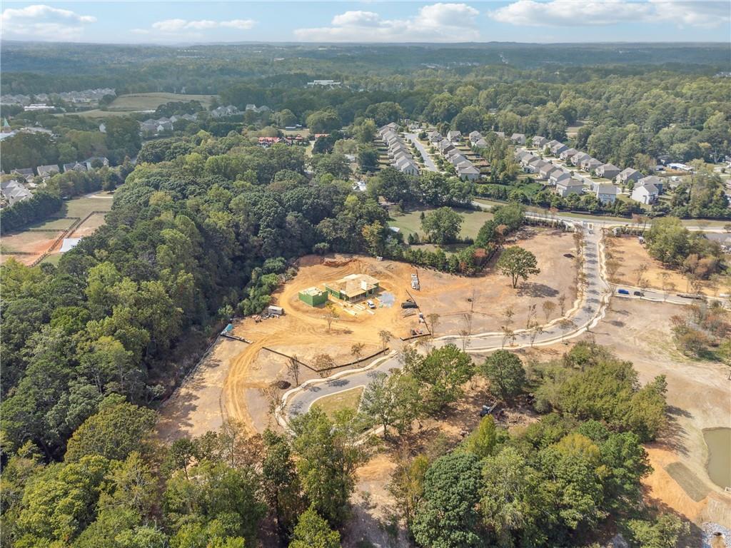 4510 Muskogee Court Cumming, GA 30040 - Photo 15 of 22 an aerial view of a house with a lake view