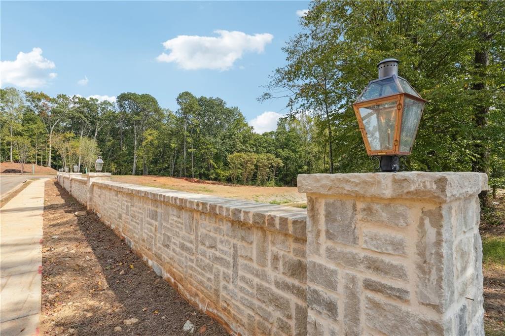 4510 Muskogee Court Cumming, GA 30040 - Photo 5 of 22 a view of a house with a yard
