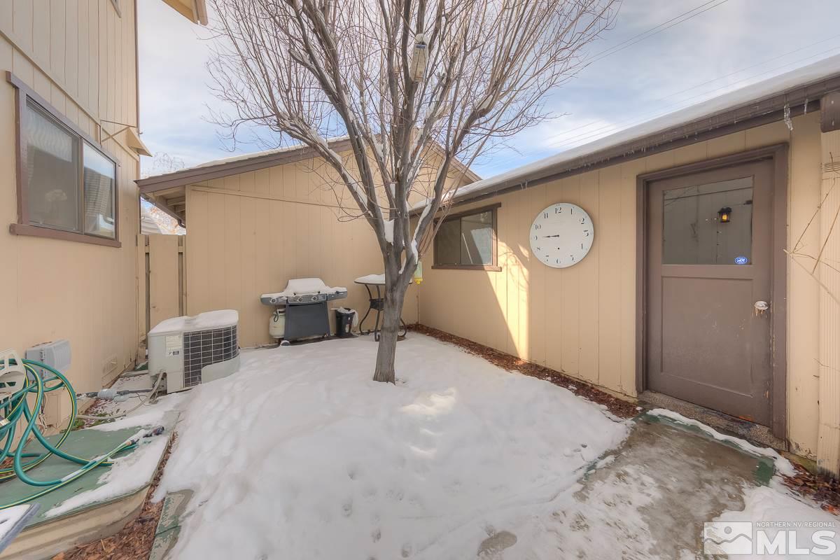 1499 Foster Drive Reno, NV 89509 - Photo 23 of 24 a view of a house with a snow in the yard