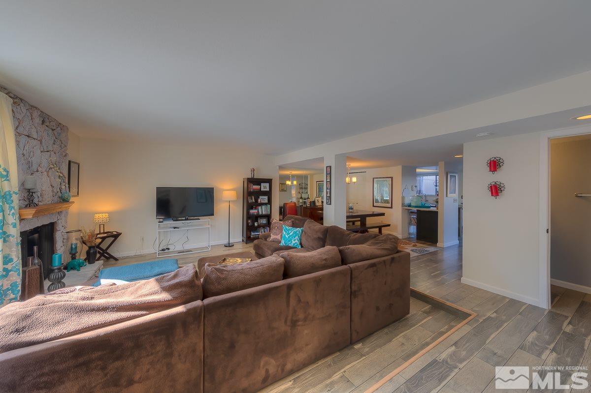 1499 Foster Drive Reno, NV 89509 - Photo 8 of 24 a living room with furniture and a flat screen tv