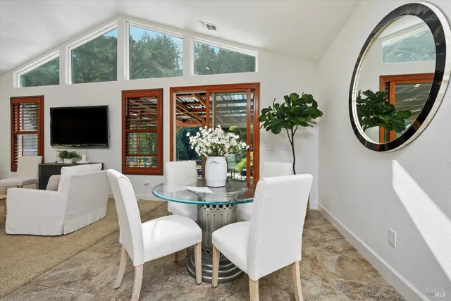 a view of a livingroom with furniture and a potted plant
