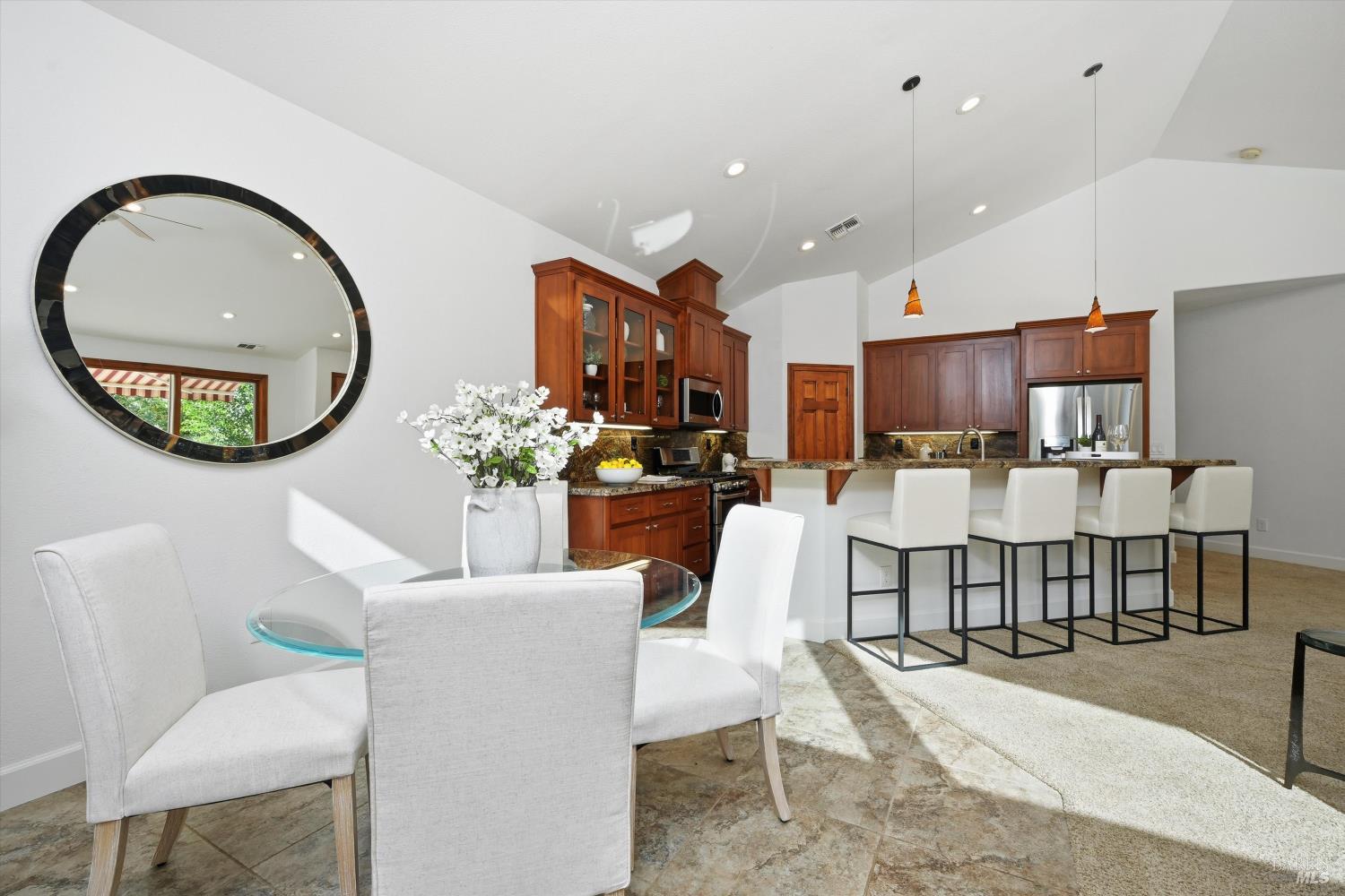 5251 Dry Creek Road Napa, CA 94558 - Photo 12 of 61 a living room with kitchen furniture and a chandelier