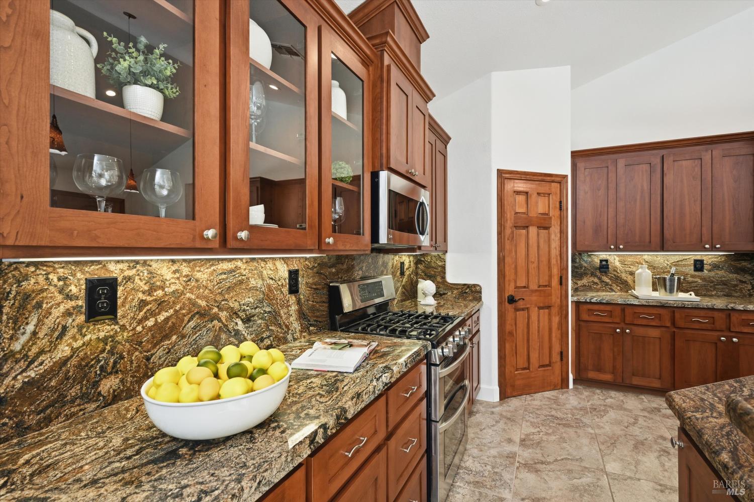 5251 Dry Creek Road Napa, CA 94558 - Photo 13 of 61 a kitchen with stainless steel appliances granite countertop a sink stove and refrigerator
