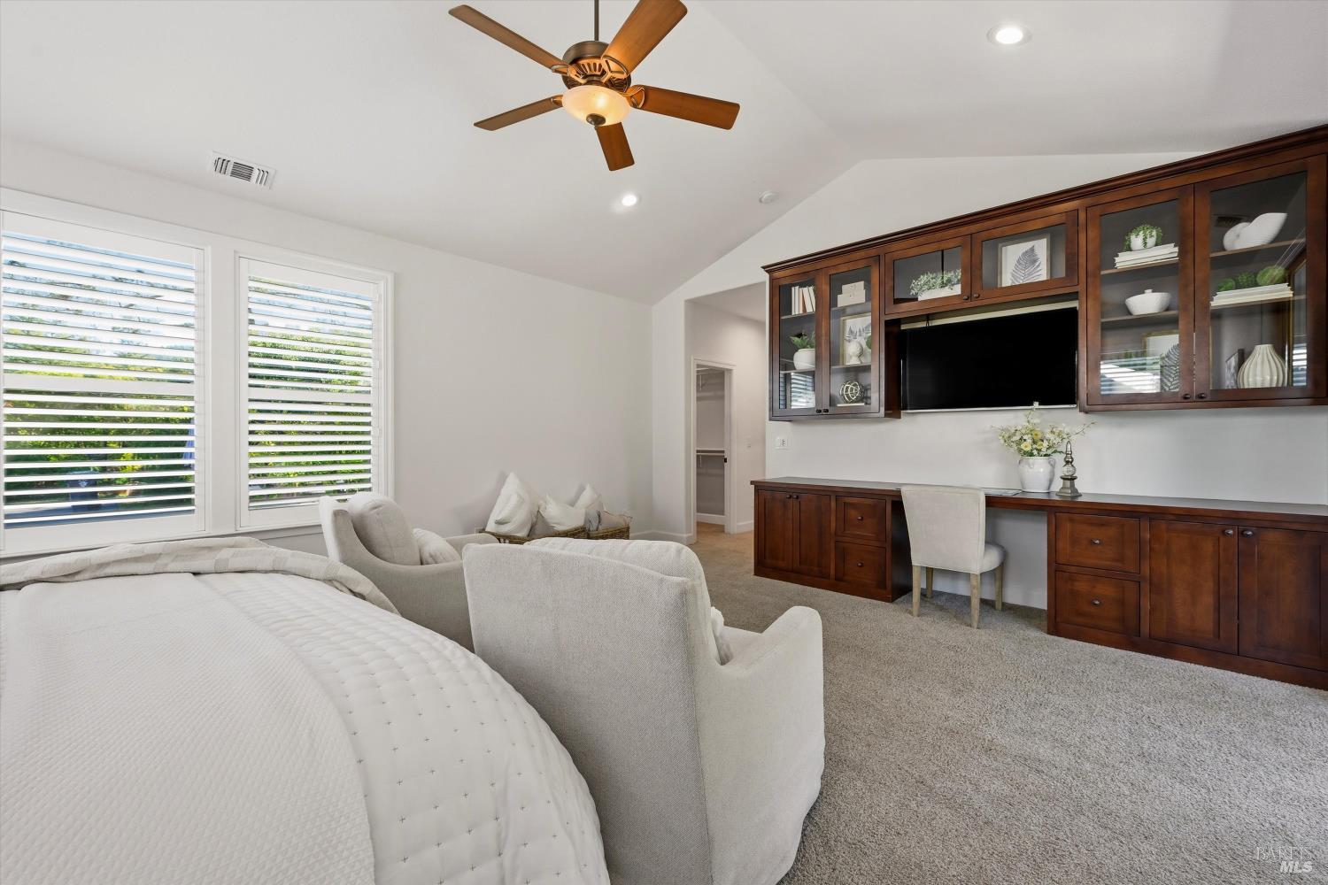 5251 Dry Creek Road Napa, CA 94558 - Photo 20 of 61 a living room with furniture a ceiling fan and a flat screen tv