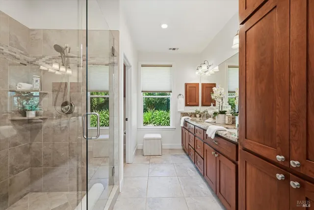 a kitchen with granite countertop a sink and cabinets