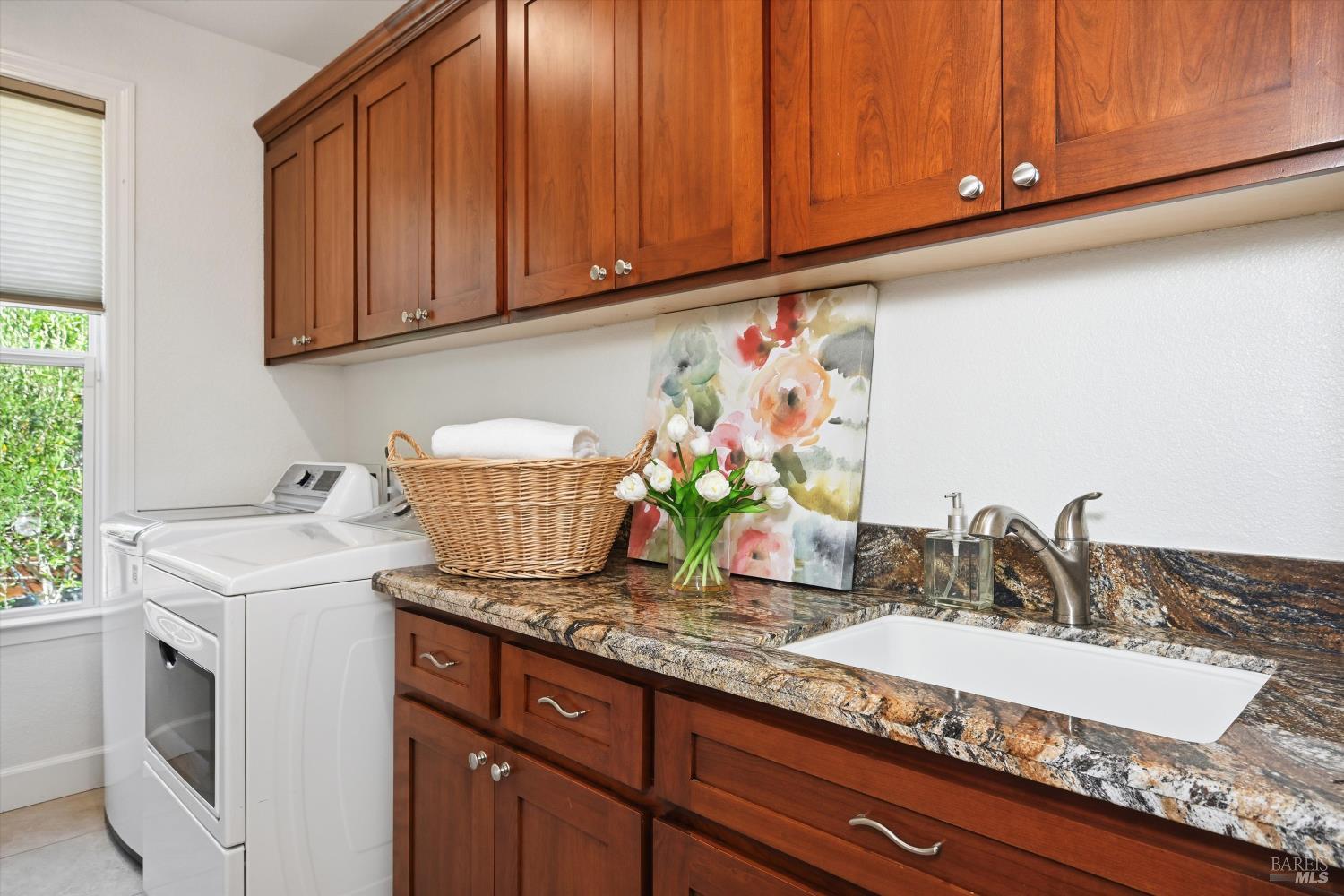 5251 Dry Creek Road Napa, CA 94558 - Photo 30 of 61 a kitchen with granite countertop a sink and cabinets