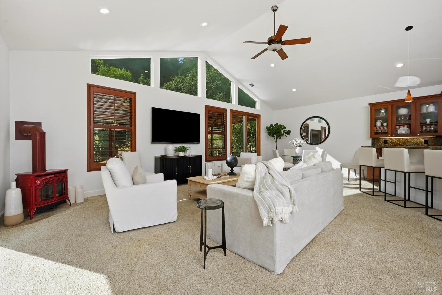 5251 Dry Creek Road Napa, CA 94558 - Photo 31 of 61 a living room with fireplace furniture and a flat screen tv