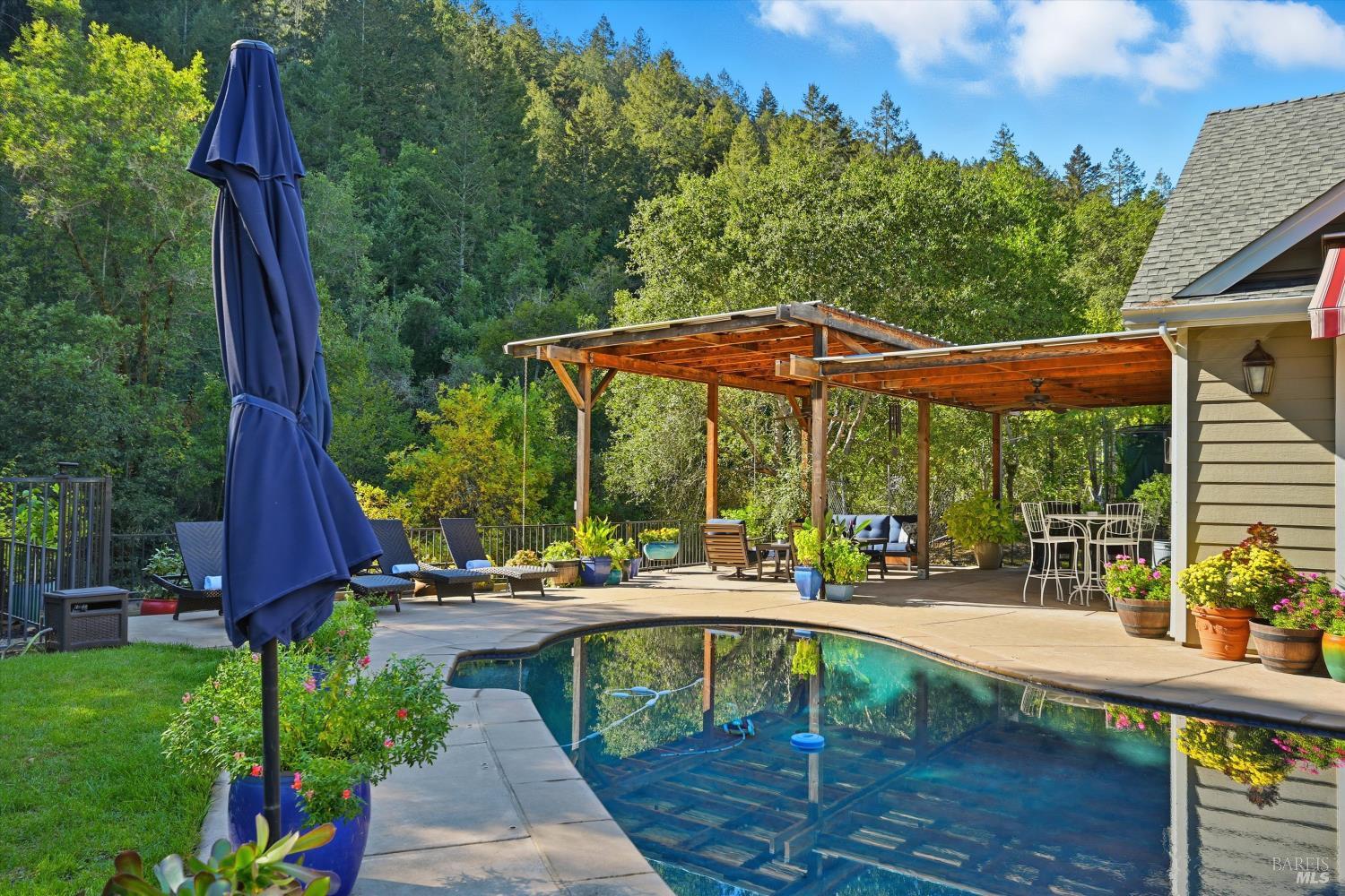 5251 Dry Creek Road Napa, CA 94558 - Photo 38 of 61 a view of backyard with swimming pool and outdoor seating