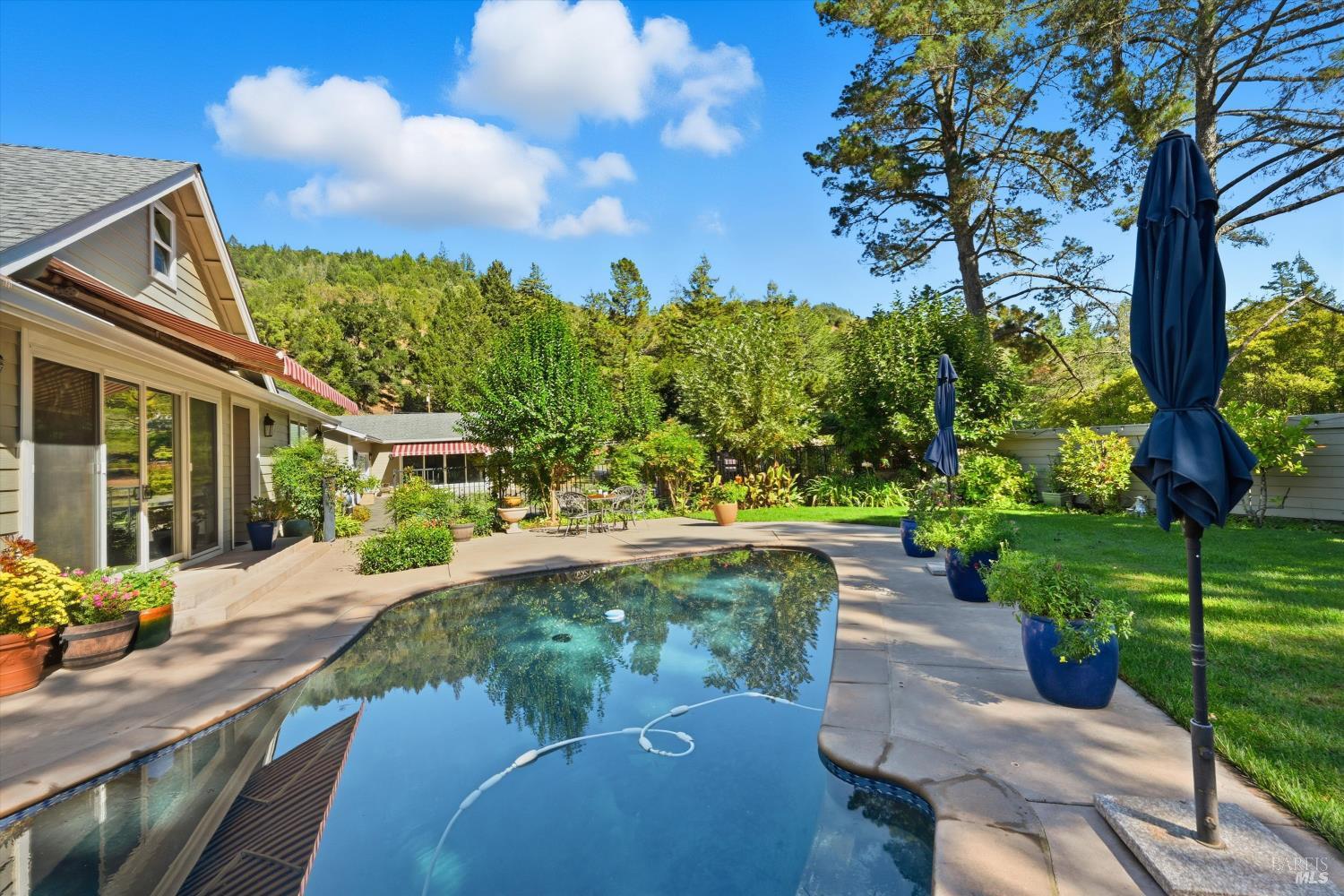 5251 Dry Creek Road Napa, CA 94558 - Photo 40 of 61 a view of a patio with a table and chairs and potted plants
