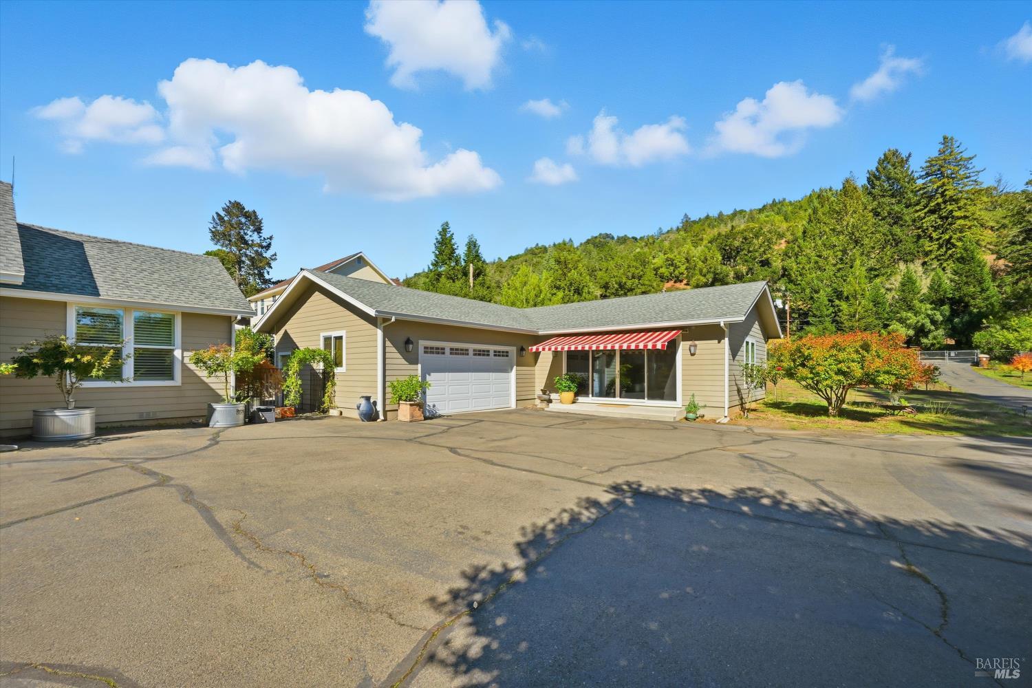 5251 Dry Creek Road Napa, CA 94558 - Photo 43 of 61 a front view of a house with a yard and garage