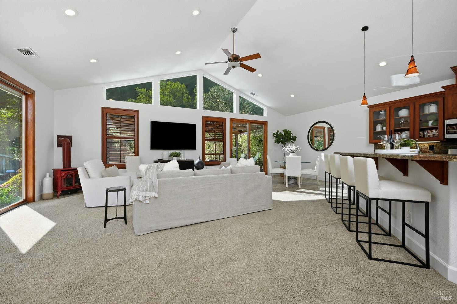 5251 Dry Creek Road Napa, CA 94558 - Photo 5 of 61 a living room with furniture and a flat screen tv