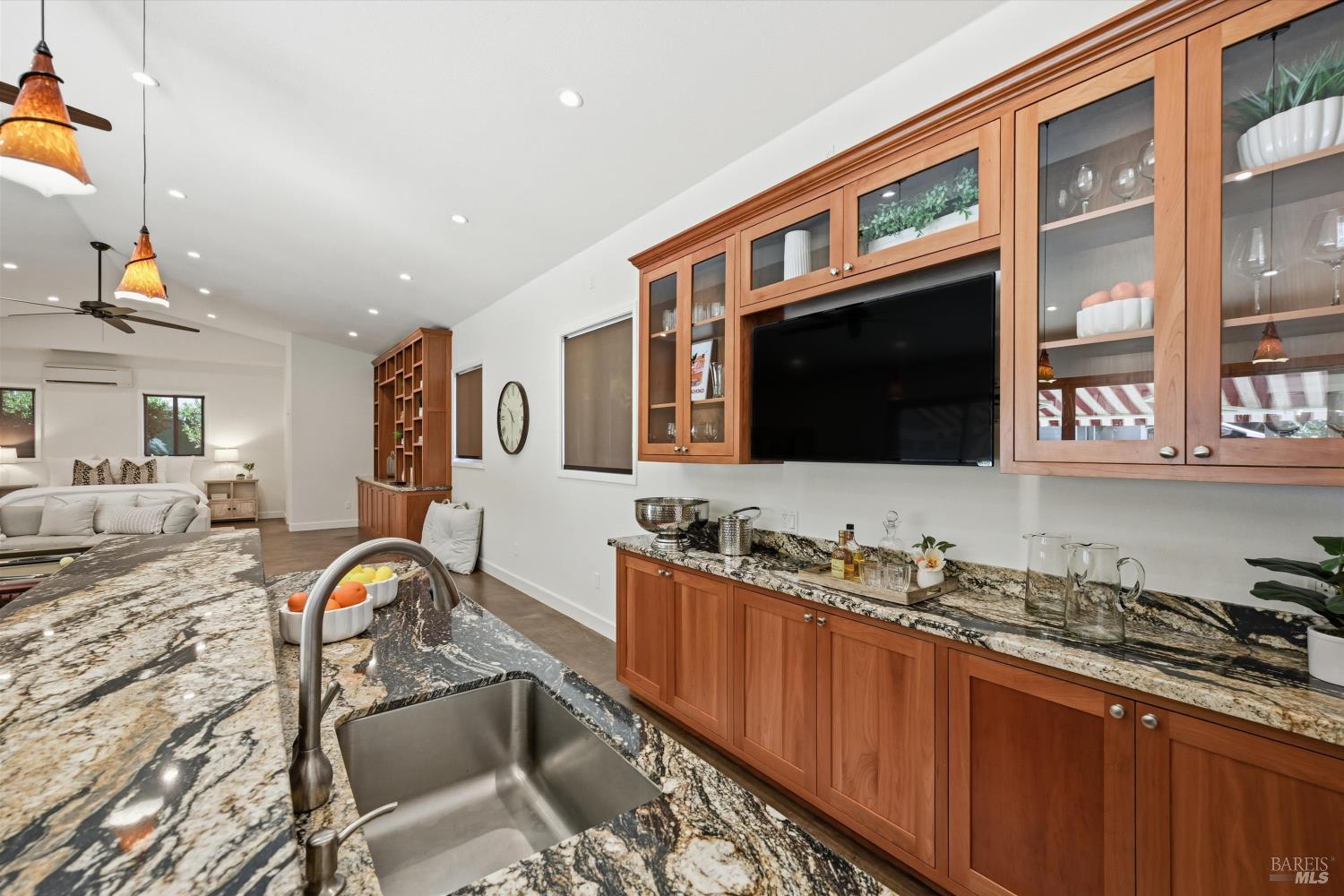 5251 Dry Creek Road Napa, CA 94558 - Photo 54 of 61 a living room with stainless steel appliances furniture a flat screen tv and kitchen view