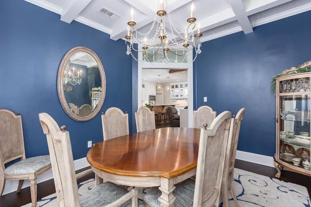 a dining room with furniture a rug and wooden floor