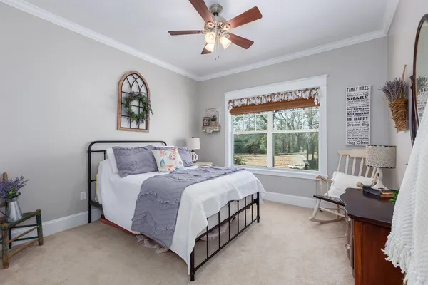a bathroom with a granite countertop toilet a sink and a mirror