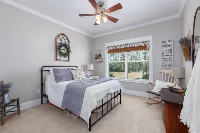 a bed room with a bed and a large window