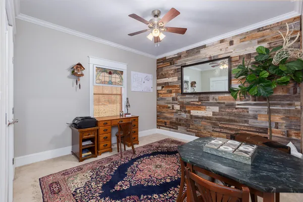 a bedroom with a bed and a fireplace