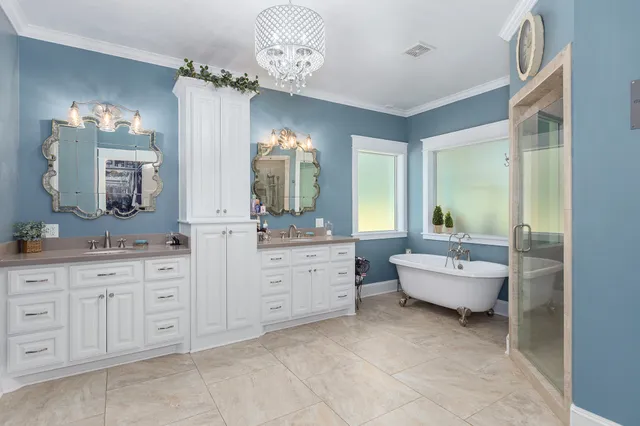 a spacious bathroom with a granite countertop sink mirror and bathtub