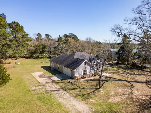 a view of a swimming pool with a yard