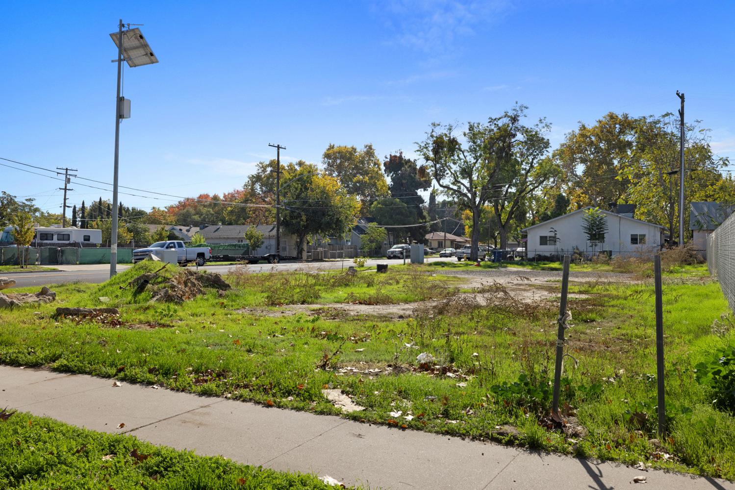 303 California Avenue Modesto, CA 95351 - Photo 4 of 10 a view of a garden with a building in the background