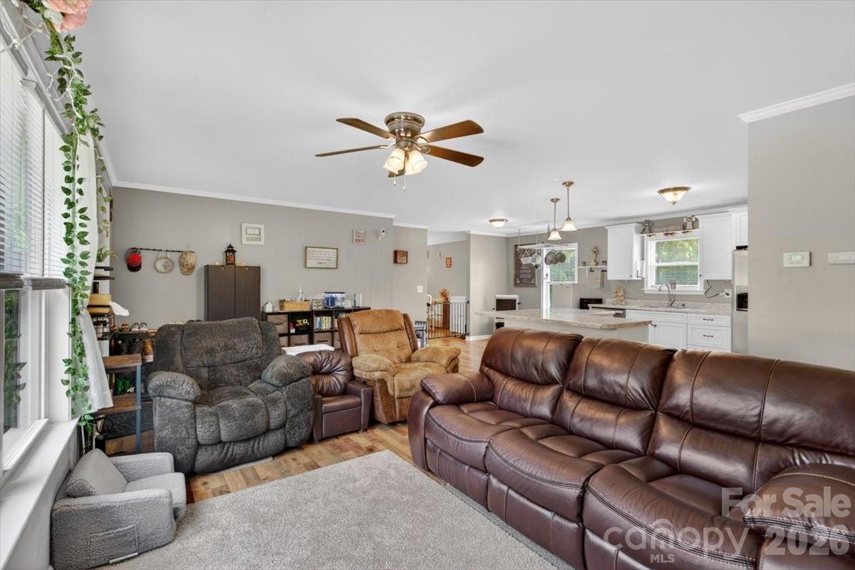567 Godbey Road Mocksville, NC 27028 - Photo 3 of 38 a living room with furniture a ceiling fan and a rug