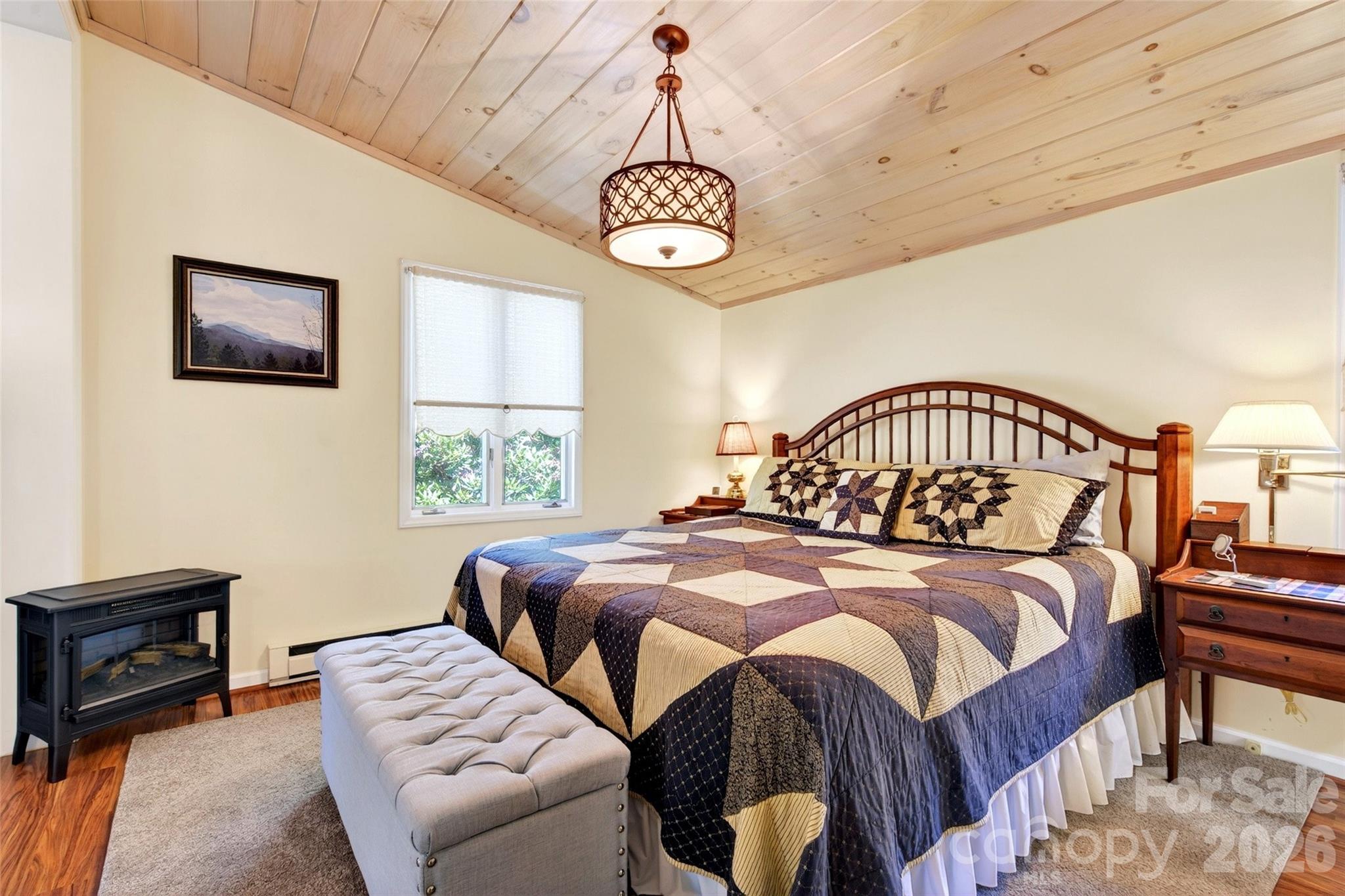 334 Harbor Lake Road Newland, NC 28657 - Photo 21 of 48 a bedroom with a bed and a window